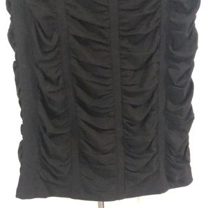 Black mid-length pencil skirt. 100% silk.